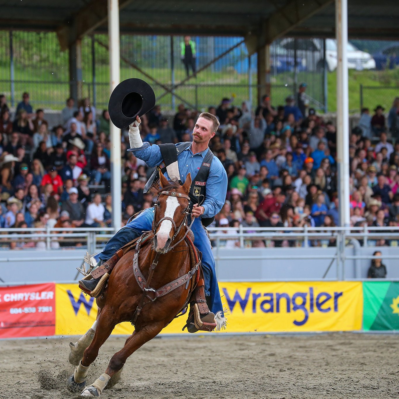 CRCF A Cowboy tips hit hat to the crowd at the Cloverdale Rodeo and Country Fair in Surrey BC CVR40846 49 Photo Credit Sean Libin